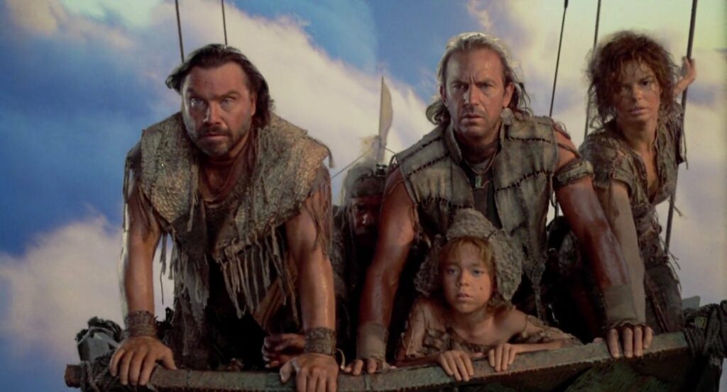 Four people in rugged, tattered clothing look intently ahead while standing on the edge of a boat. The scene appears to be set in a post-apocalyptic world, and a child is among the group. The sky in the background is bright and partly cloudy.